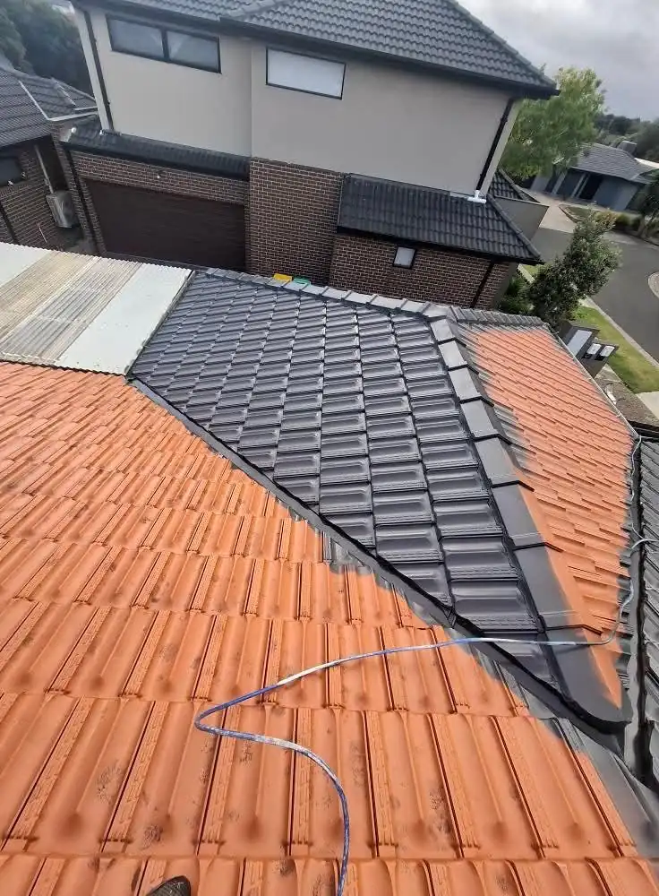 Part way: cleaned, with charcoal paint going on over the orange tiles