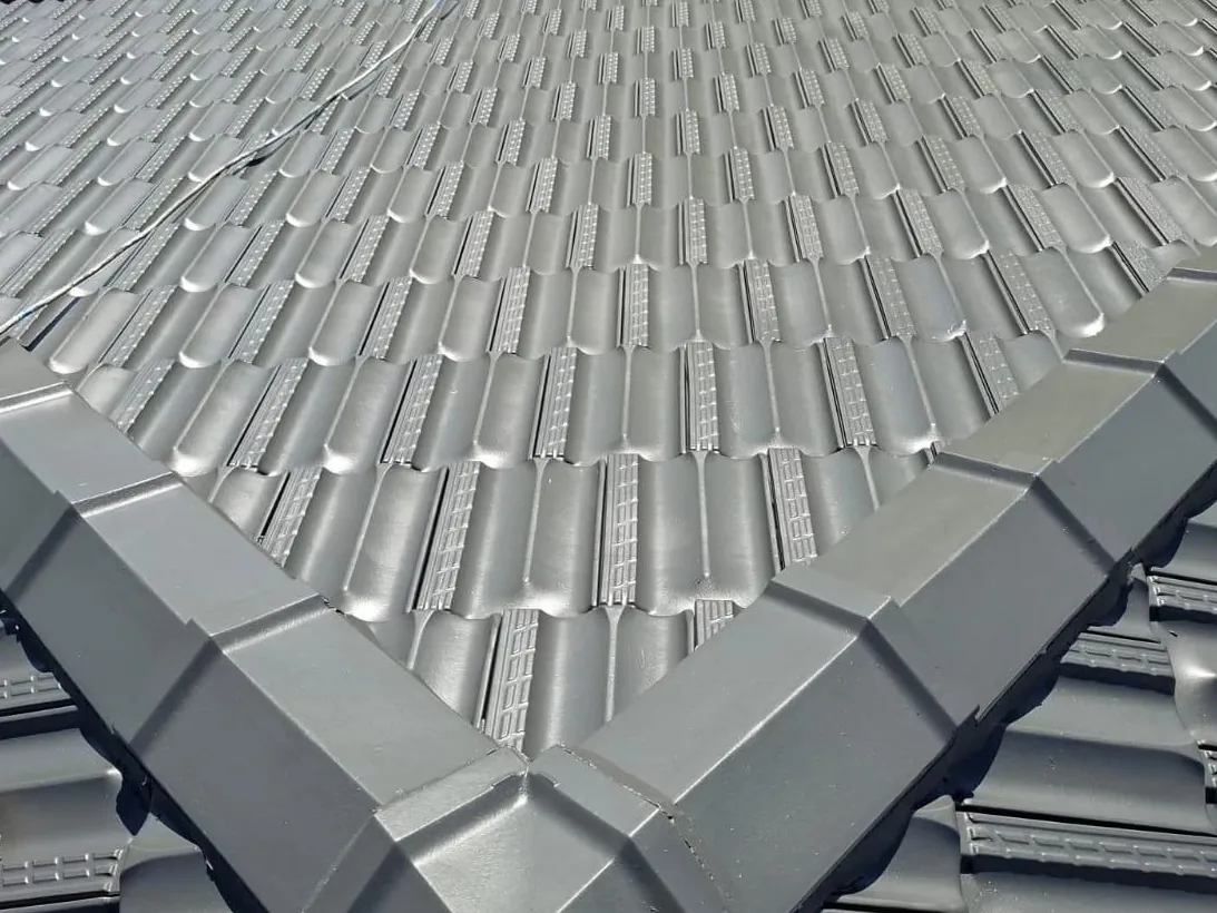 A charcoal tile roof hip after a clean, repoint and paint